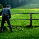 scythe grass cutting